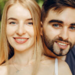 Beautiful couple spend time on a summer forest